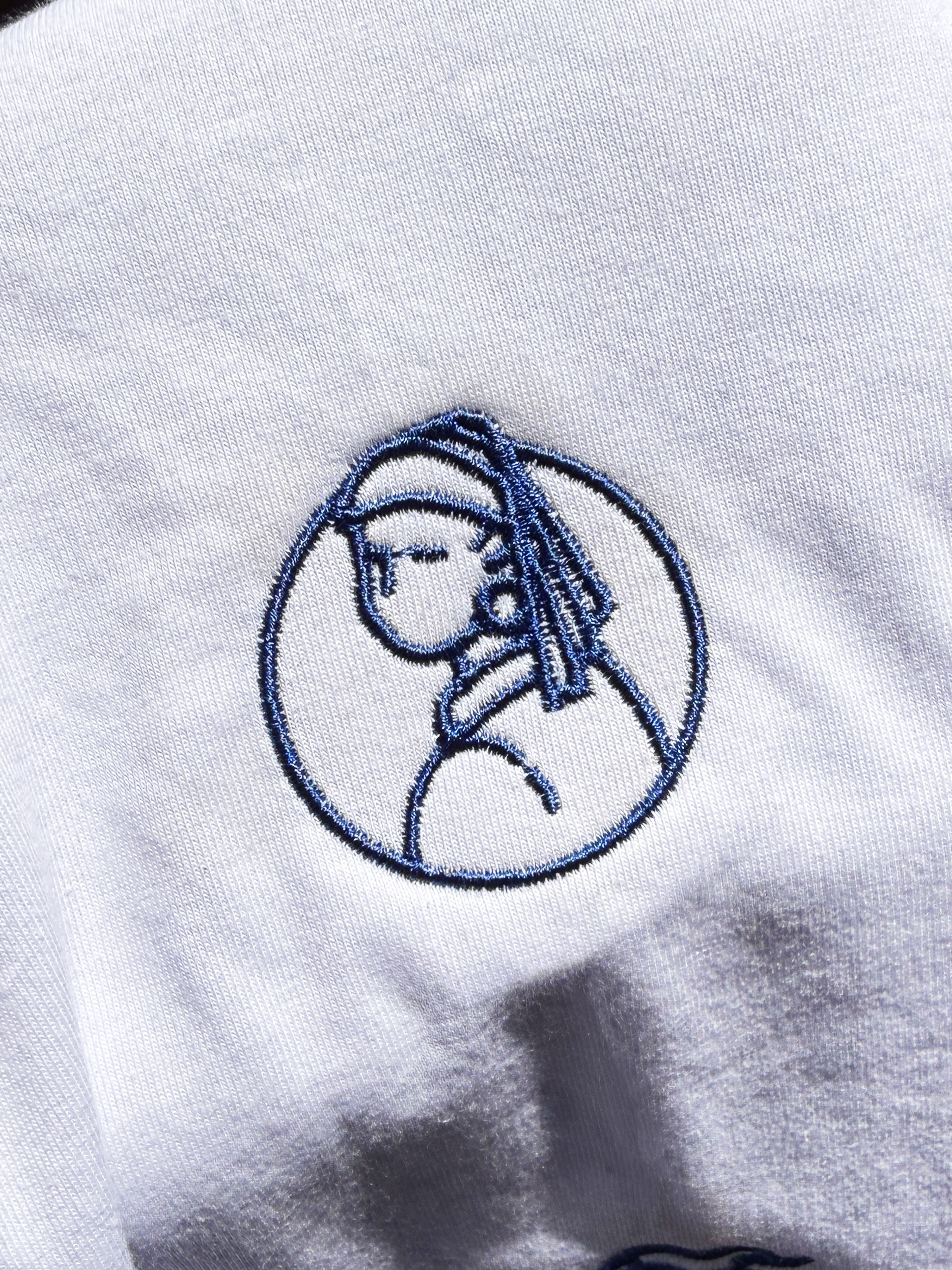 La Joven de la Perla (Emblema)