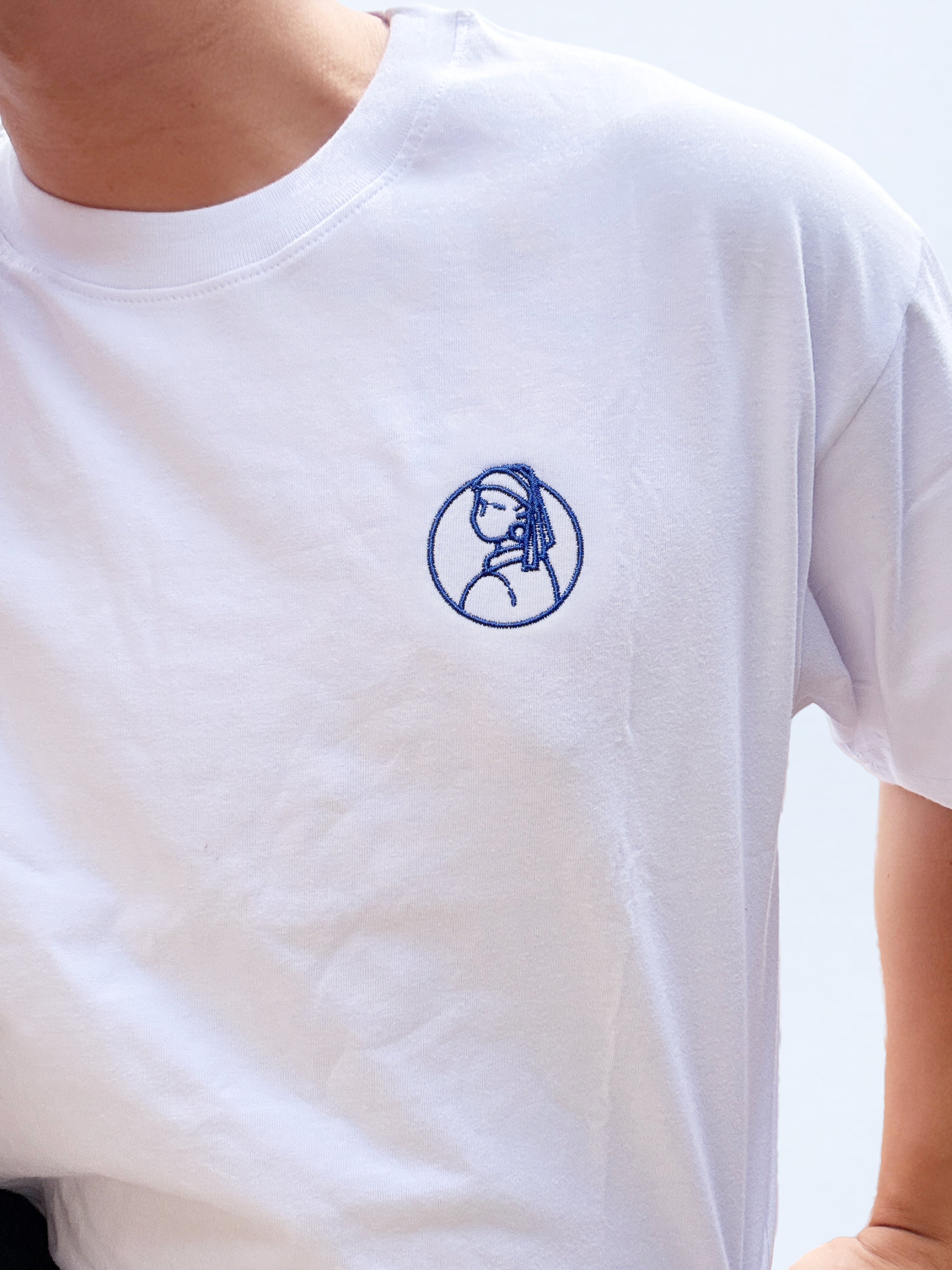 La Joven de la Perla (Emblema)